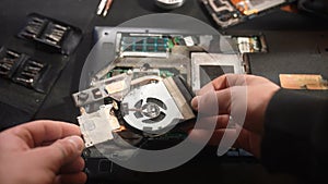 Hands Disassembling Laptop for Repair Process