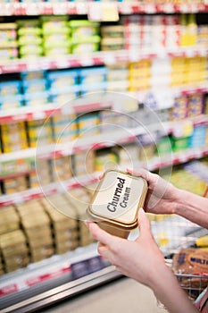 Close up view of hands holding churned cream