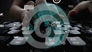 Close-up View of Hands Typing on a Keyboard with Overlay of Global Map and Data Visualization Representing Digital