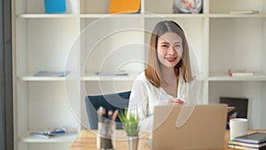 Close up view of happy businesswomen working with computer laptop