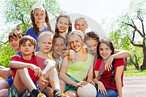 Close-up view of happy teenagers sitting close