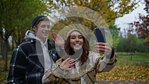 Close up view of happy young lovers making video call with greetings.