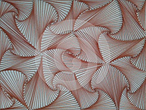 Close up view on homemade red string art abstract pattern and needles