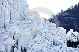 Close-up shot of a spectacular icefall in the mountains. photo