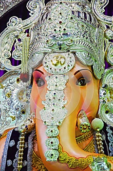 Close up view of an idol of Lord Ganesha, Tulshibaug Mandal, Pune, Maharashtra, India. photo
