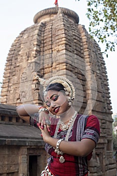 Close up view of Indian girl dancer in the posture of Indian dance. Indian classical dance Odissi.