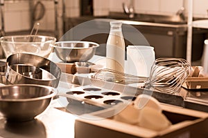 close up view of ingredients for dough and kitchen utensils on counter in restaurant