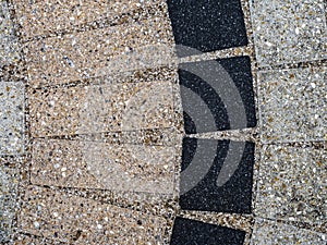 Close up view of inlaid tiles that form the top surface of a table