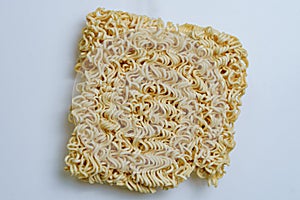 A close up view of a instant noodle cubes and white background