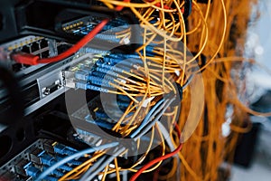 Close up view of internet equipment and cables in the server room