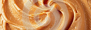 Close up view of intricate liquid caramel swirl with smooth lines as a delicate background