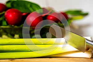 Close-up view of a knife cutting onion