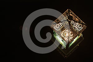 Close-up view on lantern in a dark background