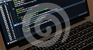 Programming Code on Laptop Screen with Keyboard
