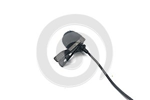 Close-up view of a lavalier microphone on a white background