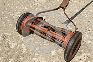 a close up view look at a reel lawnmower before the paint was removed