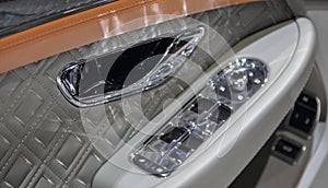 A close up view of luxurious car door panel photo