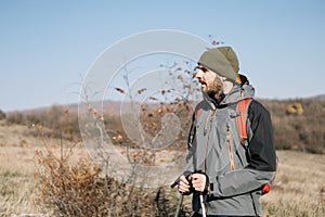 Close-up view of male tourist standing on field