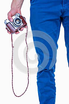 Close up view of man hand holding retro photo camera