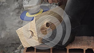 Close up view of man`s hands working a wooden table