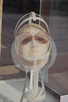 Close up view of mannequin with fashionable sunglass in shop