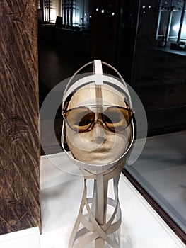 Close up view of mannequin with various fashionable sunglass in shop