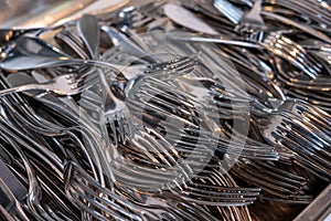 close-up view of many metal forks, flat ware