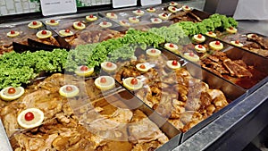 Close-up view of the marinated meat on the ice selling in the supermarket