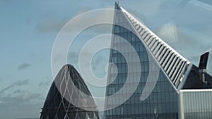 Close-up view of the Mary Axe building`s top also known as Gherkin in the center of London, England. Action. Modern