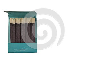 Close up view of matches in cardboard green pack on white background isolated.
