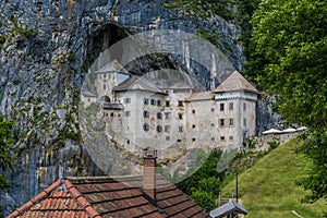 A close up view of the medieval castle built into the cliff face at Predjama, Slovenia