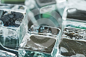Close up view of melting transparent clear square ice cubes