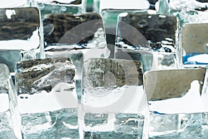 Close up view of melting transparent clear square ice cubes