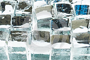 Close up view of melting transparent clear square ice cubes