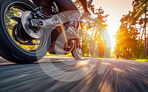 Close-up view of a motorcycle speeding on the road seen from below