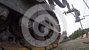 Close-up view of moving caterpillar track of heavy vehicle