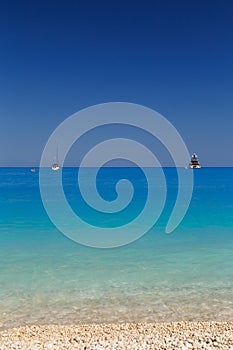 Close up view at Myrtos Beach with turquoise and blue water. Greek islands. Summer scenery of famous and extremely