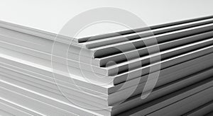 A close up view of a neatly stacked pile of white paper sheets