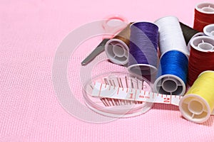 close up view, needle, scissor, thread, tailor Meter, at Pink Background