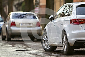 Close-up view of a new modern car parked on the side of the street