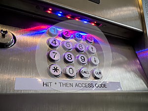 Close up view of a number pin pad for inputting an access code for a high rise building