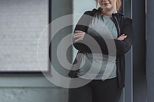 Close-up view of obese girl in gym