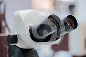 Close up view: ocular lens, eyepieces of optical microscope
