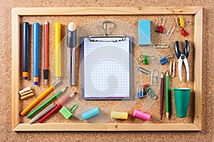 Close up view of the office tools on cork board
