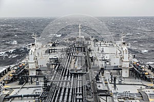 Close-up view of oil tanker deck with cranes