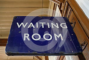 Close-up view of an old metal British Railway waiting room sign.