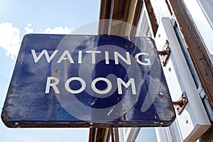 Close-up view of an old metal British Railway waiting room sign.