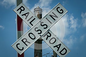 A Close up View of an Old Rail Road Crossing Sign