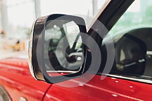 Close-up view of old rearview mirror on retro car.