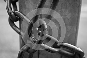 Close-up view of old rusty chain links.